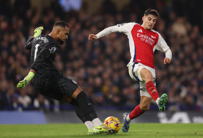 London, England, 10th November 2024. Robert Sanchez of Chelsea is pressed by Kai Havertz of Arsenal during the Premier L