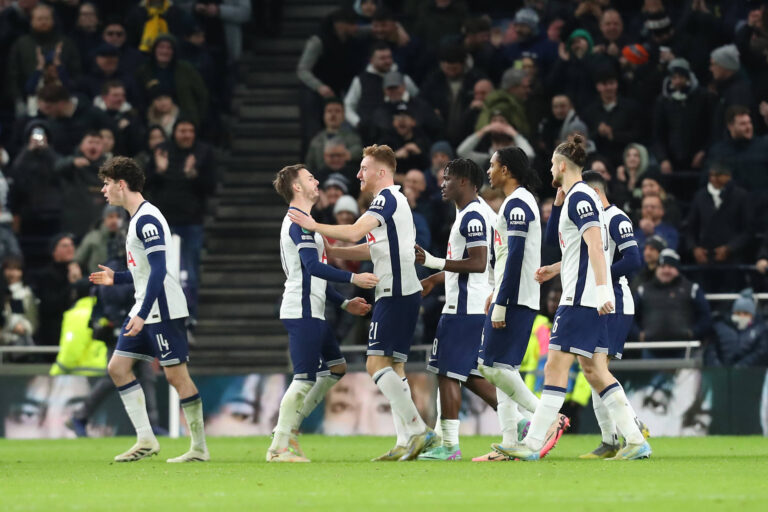 Tottenham hotspur player Dejan Kulusevski celebrates with teammates