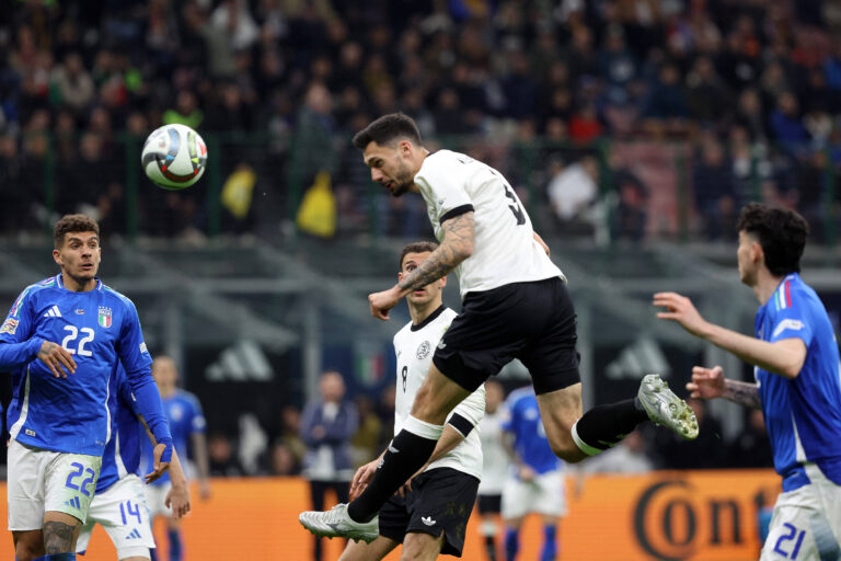 Tim Kleindienst of Germany scores against Italy