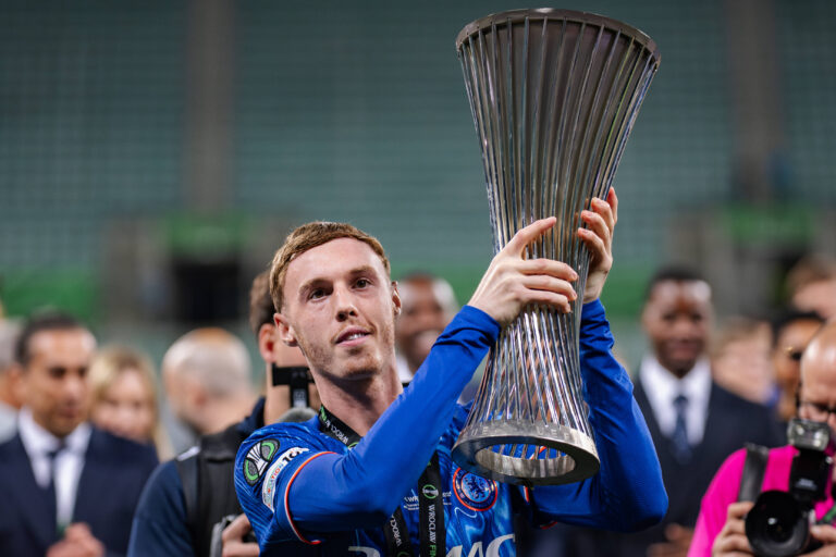 Cole Palmer of Chelsea lifts the 2024/25 UEFA Conference League trophy